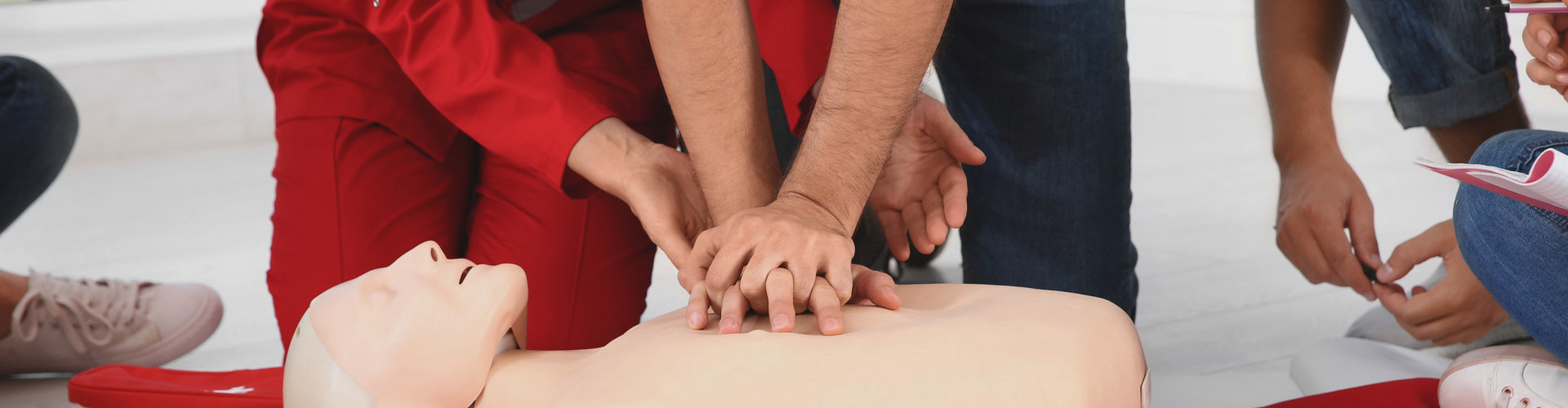 students performing cpr